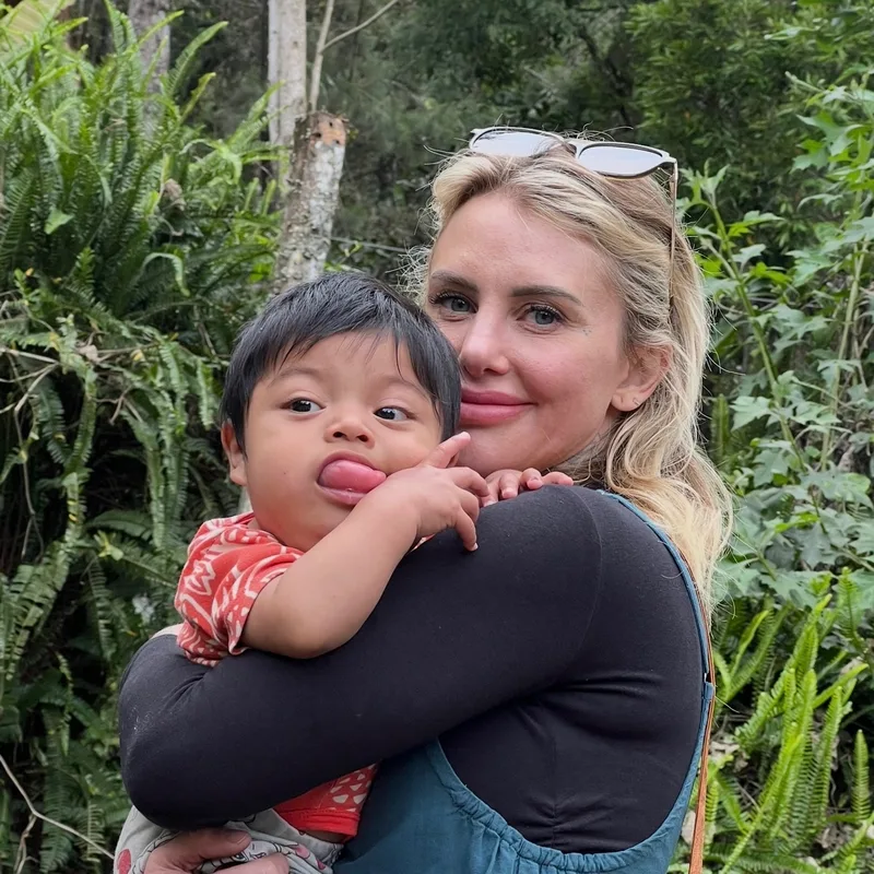 Jeannette McKeever holding a child in Guatemala